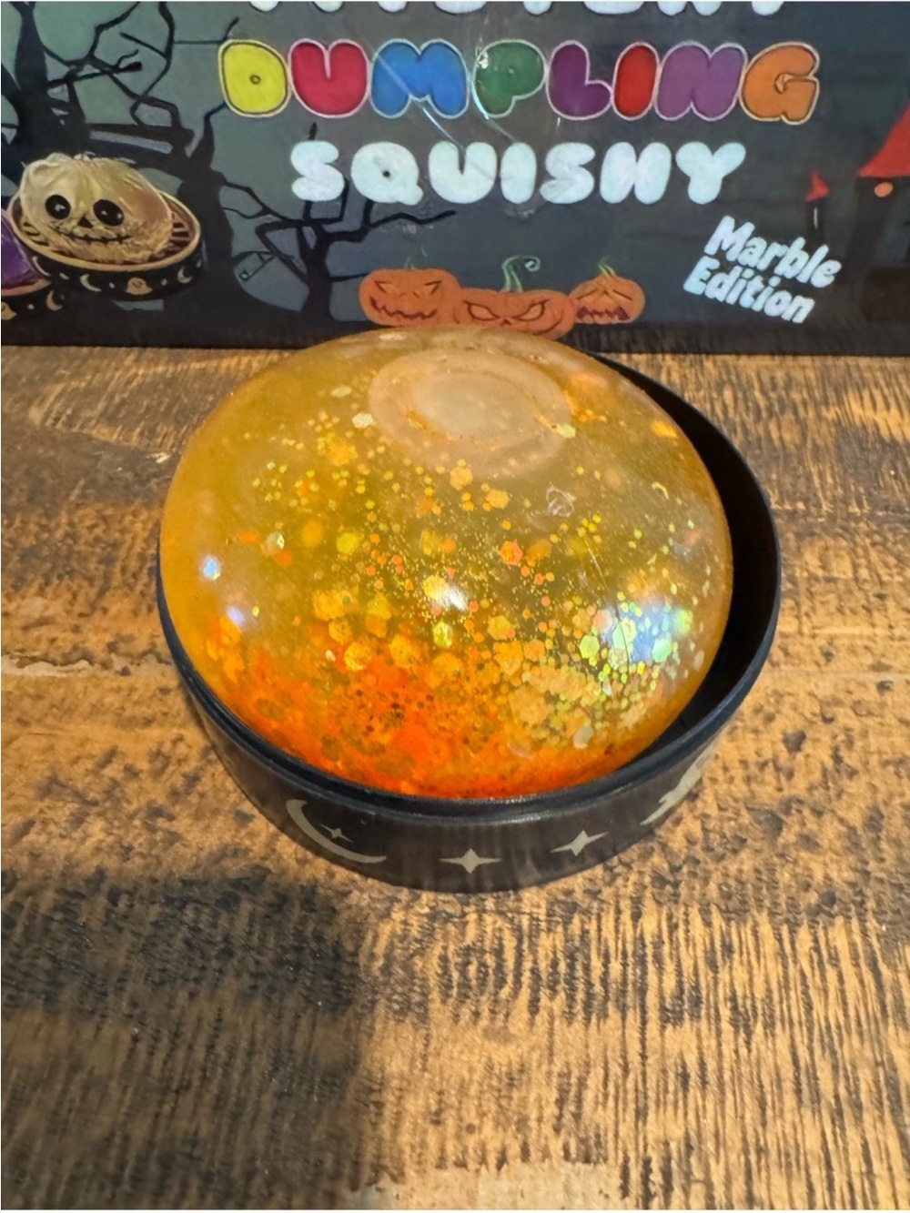 Halloween Pumpkin Dumpling Glitter Squishy w/ Storage Case - Orange Sensory Toy - Picture 5 of 8